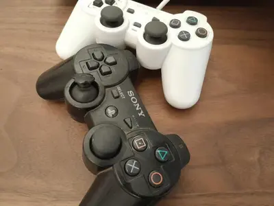 two video game controllers sitting on top of a table at Serene City Escape in Meknès