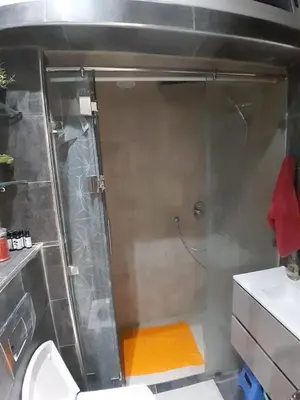 a small bathroom with a shower and a toilet at Serene City Escape in Meknès