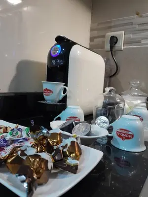 a counter top with some food and a coffee maker at Serene City Escape in Meknès