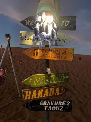 a street sign in the middle of the desert at Azadic luxury tents in Merzouga