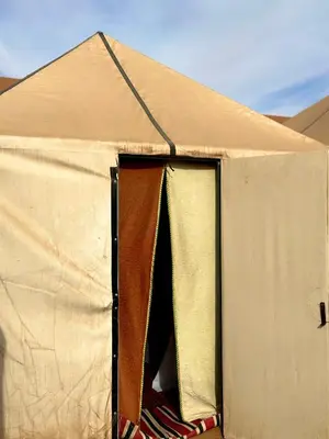 an open door of a tent with a roof at Sahara Joy Camp in Merzouga