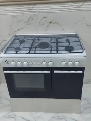 a stove top oven sitting on top of a counter at Cozy GenYcool Apartment Meknes Center in Meknès