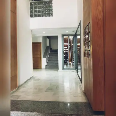 a hallway of a home with a staircase and a stair case at إقامة حسن in Fès
