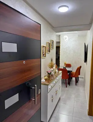 a kitchen with a large sliding door with a dining room at Alyassamine Taza in Settat