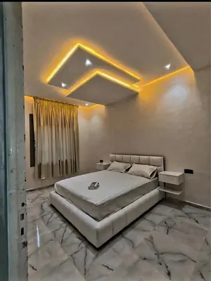 a bedroom with a large bed in a room at Massira 2 in Taza