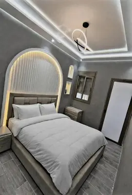 a bedroom with a large bed in a room at Massira 2 in Taza