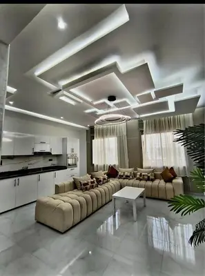 a large living room with couches and a table at Massira 2 in Taza