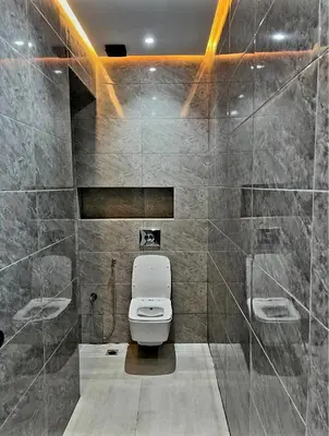 a bathroom with a white toilet in a room at Massira 2 in Taza