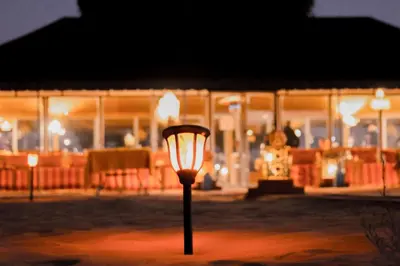 a street light in front of a building at night at Maria'S Luxury Camp in Merzouga