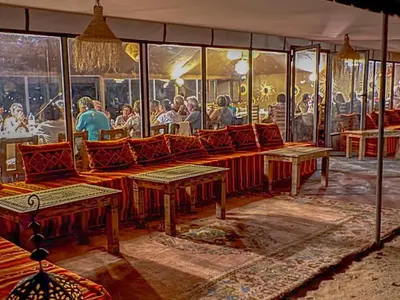 a rendering of a restaurant with people sitting at tables at Maria'S Luxury Camp in Merzouga