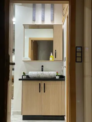 a bathroom with a sink and a mirror at Air-conditioned apartment Atlas star in Azrou