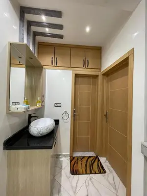 a small bathroom with a sink and a shower at Air-conditioned apartment Atlas star in Azrou
