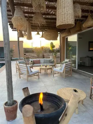 a fire pit in the middle of a patio at Luxury VILLA - Pool-view Atlas-Ourika-Golfs in Akkara