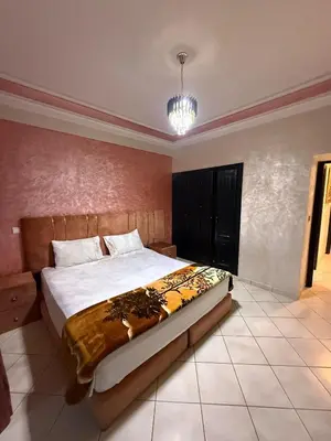 a bedroom with a large bed in a room at basim swedin in Oulad Akkou
