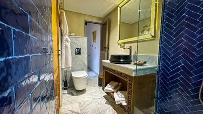 a bathroom with a sink and a toilet at Dar Magic Fes in Fès