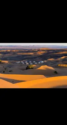 a picture of a desert with sand dunes at Merzouga Desert Family Host tata- Hassi Labied Dunes View & Tours in Hassilabied