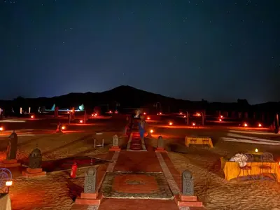a view of a cemetery at night with lights at Big Dipper Luxury Camp in Merzouga
