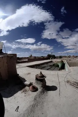 a hat sitting on the ground in the desert at Oasis travel in Ksar Tazouga