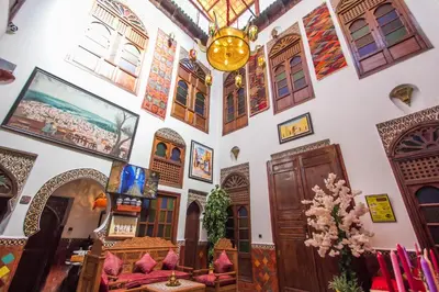 a room with a bunch of doors and windows at Riad Dar Mansoura in Fès