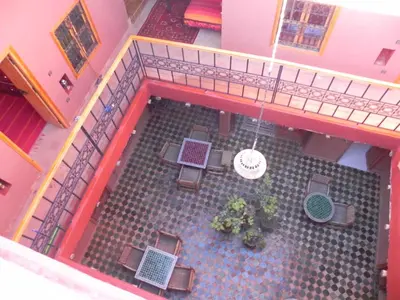 an overhead view of a patio with tables and chairs at Kasbah Petit Nomade in Tinerhir