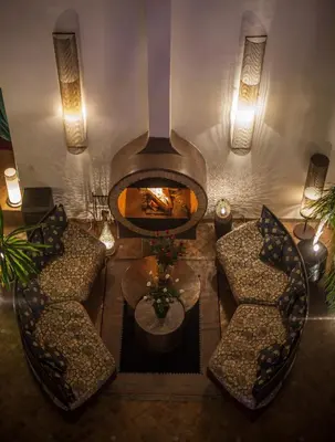 an overhead view of a living room with a fireplace at Riad Almaz in Fès