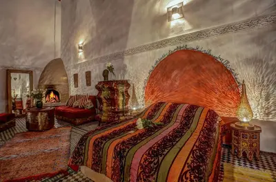 a bedroom with a large bed in a room at Riad Almaz in Fès