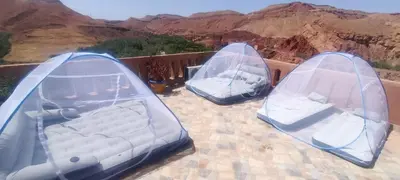 three inflatable trampolines sitting on top at Citadelle Gorges in Ait Ben Ali