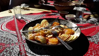 a bowl of food sitting on top of a table at Sahara Peace in Mhamid
