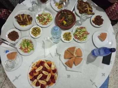 a table with plates of food on a table at Dar Hlimi in Fès