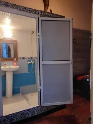 a bathroom with a shower and a sink at Dar Berrada-Ziat in Fès