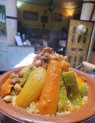 a plate of food with vegetables and nuts at Dar Berrada-Ziat in Fès