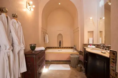 a large bathroom with a tub and a sink at Villa Jannah in Marrakech