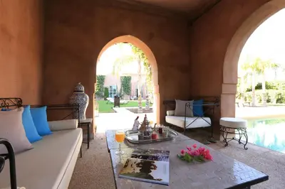 a living room with a couch and a table at Villa Jannah in Marrakech