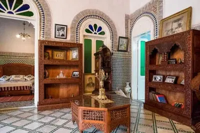 a room with a bedroom with a bed and a table at 2 BR Charming Apartment Fes in Fès