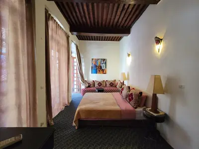 a bedroom with a large bed in a room at youssef in Fès