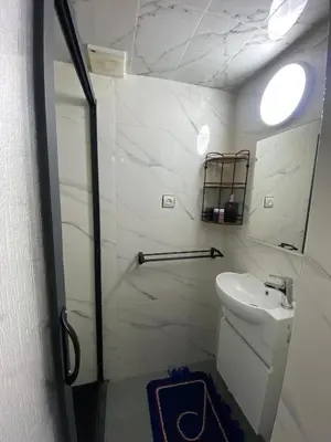 a bathroom with a toilet and a sink and a mirror at La Casa Espanyola in Fès