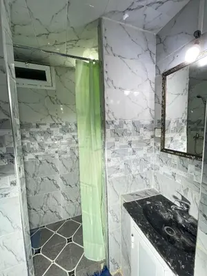 a bathroom with a sink and a mirror at La Casa Espanyola in Fès