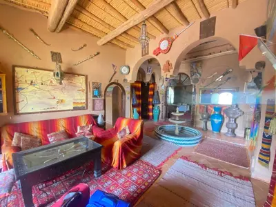 a living room with a couch and a table at Riad Dar Barbara in Ouarzazate