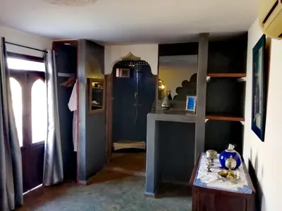 a room with a room with bunk beds in it at Les Bains de Fez Tara in Fès