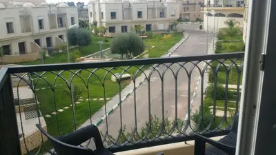 a balcony with a view of a street and buildings at Hotel Arena Fes in Fès
