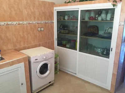 a laundry room with a washer and dryer at Vittel Ifrane Large and Beautiful Apartment in Ifrane