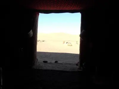 a view of the desert from a window in a building at Bivouac Draa in Zagora