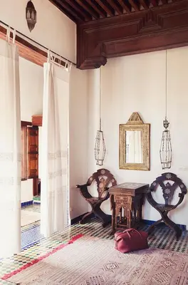a living room with a table and two chairs at Dar Seffarine in Fès