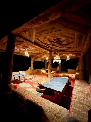 a large room with a table in the middle at Royal Sands Camp - Erg Chigaga Luxury Camp in Mhamid