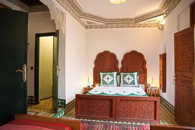 a bedroom with a bed in a room at Riad Ouliya in Fès