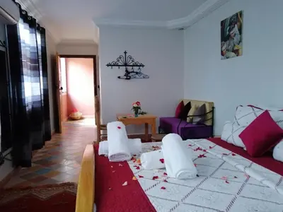 a room with a bed with debris on the floor at RIAD Camping ATLAS in Tinerhir