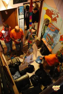 a group of people standing in a room with luggage at Ouarzazate Youth Hostel YHO in Ouarzazate