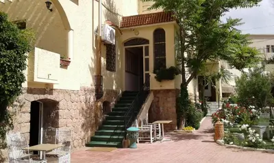 a building with stairs and a building with a fire hydrant at Villa Pomme d'Or in Midelt