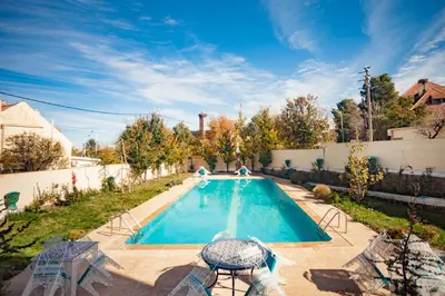 a swimming pool in the backyard of a house at Villa Pomme d'Or in Midelt