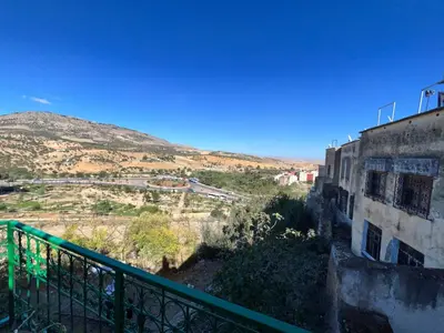a view of a mountain from a building at Fès Riad Scalia Traditional Guesthouse Morocco in Fès